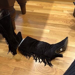 Gently used suede boots with rear tassels.